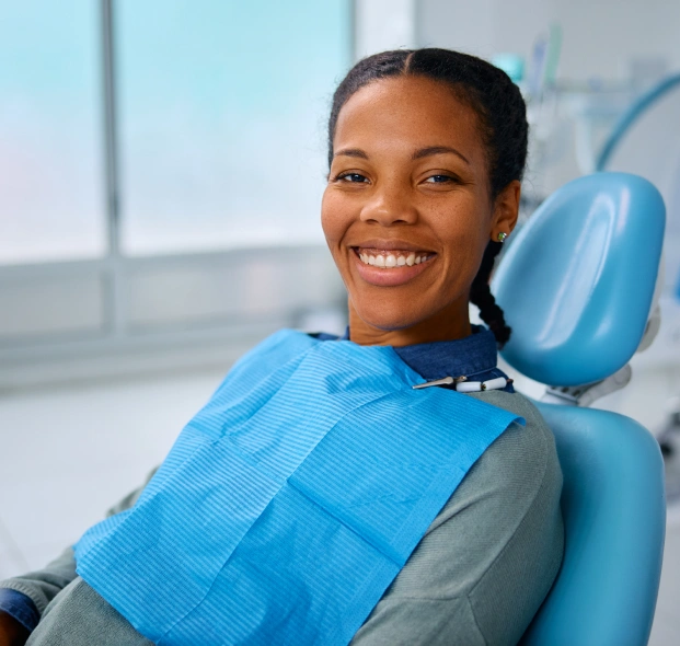 A smiling patient in a dental chair, ready for a consultation at cosmetic dentistry Alpharetta.