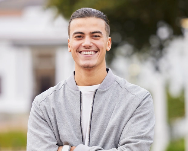 Confident man showcasing smile makeover results in Alpharetta, GA.