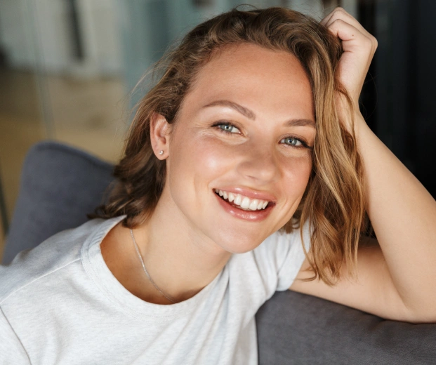 Happy patient showcasing a healthy smile makeover in Johns Creek.